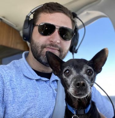 Pilot and Dog in Cockpit
