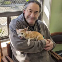 Man holding small dog