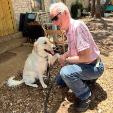 Larry and Calli shake hands/ paws dog and man shaking hand/ paw