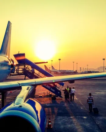 Passengers boarding large jet plane