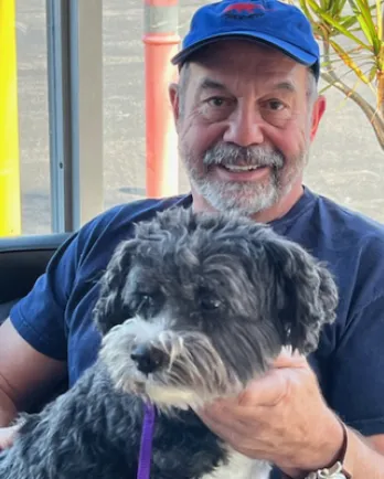 Man with Dog in Lap