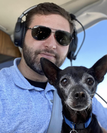 Pilot and Dog in Cockpit