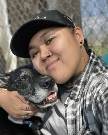 dog giving person a hug