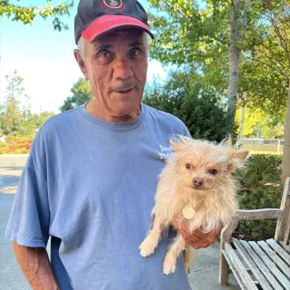 Junior Man holding small dog