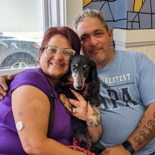 Dachshund with two people