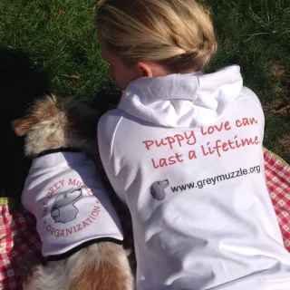 Chandra and Mason with their Grey Muzzle shirts